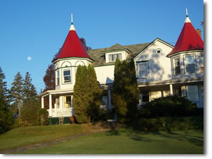 Main house with moon in background.